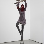 Marcel Dzama Polutropos of many turns, 2009 Mannequin costumé (robe, bas, Balaklava) sur base rotative et bois découpé / Mannequin on rotating base and costume (dress, socks, mask) and wood 221 x 58,4 x 101,6 cm Avec l’aimable permission de l’artiste et David Zwirner, New York