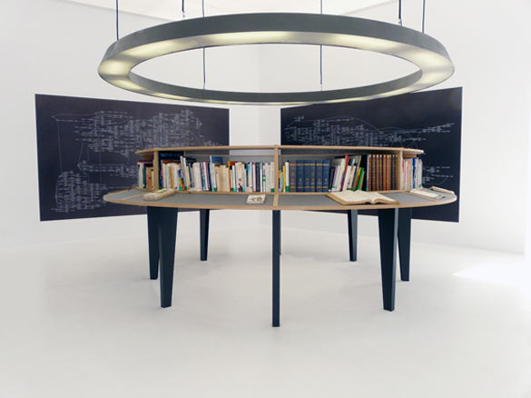 Julien Prévieux, La totalité des propositions vraies (avant), 2009. Livres, bibliothèque, lustre et impressions jet d’encre, dimensions variables / Books, book-case, ceiling light, inkjet prints, variable dimensions.